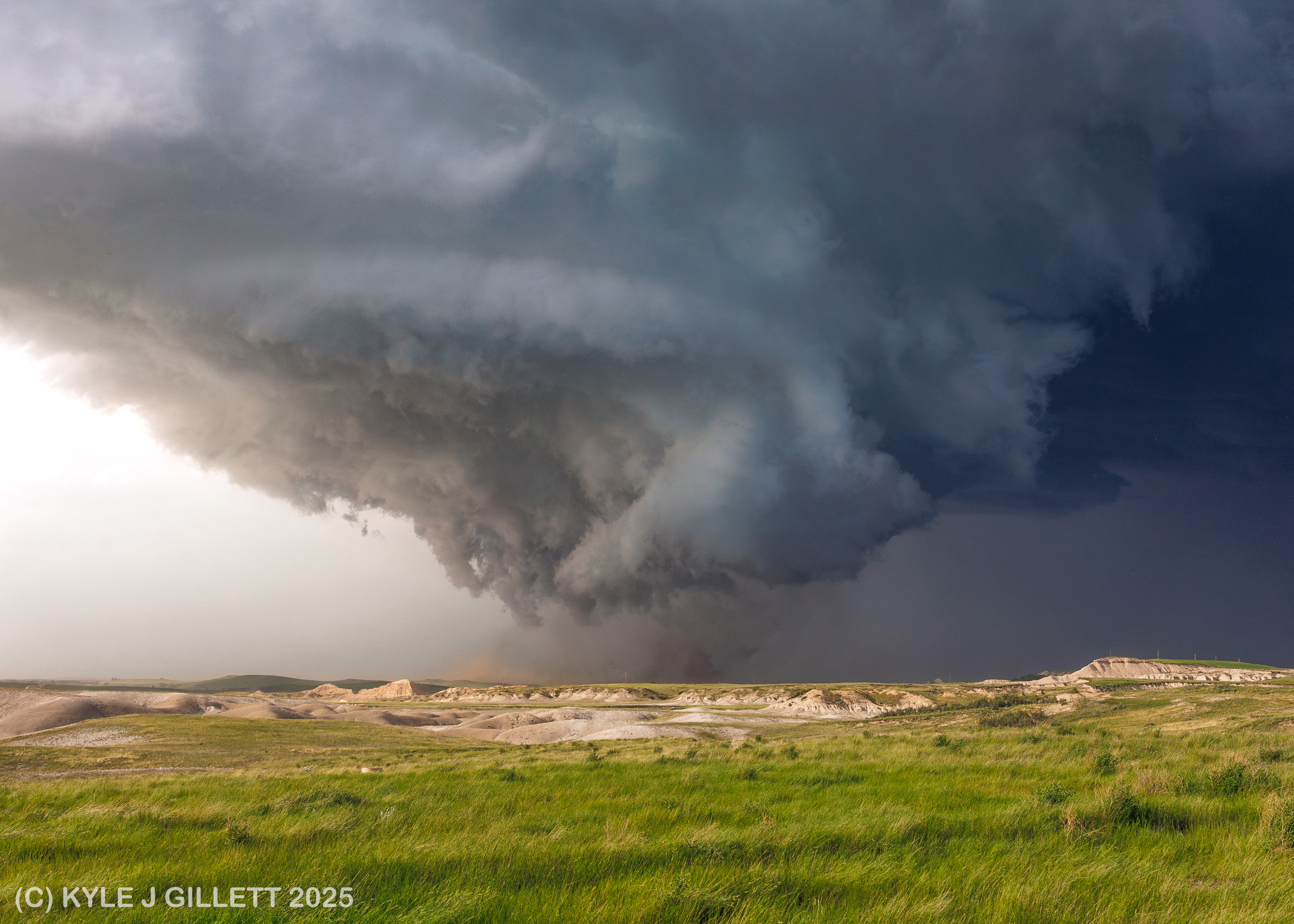 Dust being lifted beneath the broad tornadic circulation.