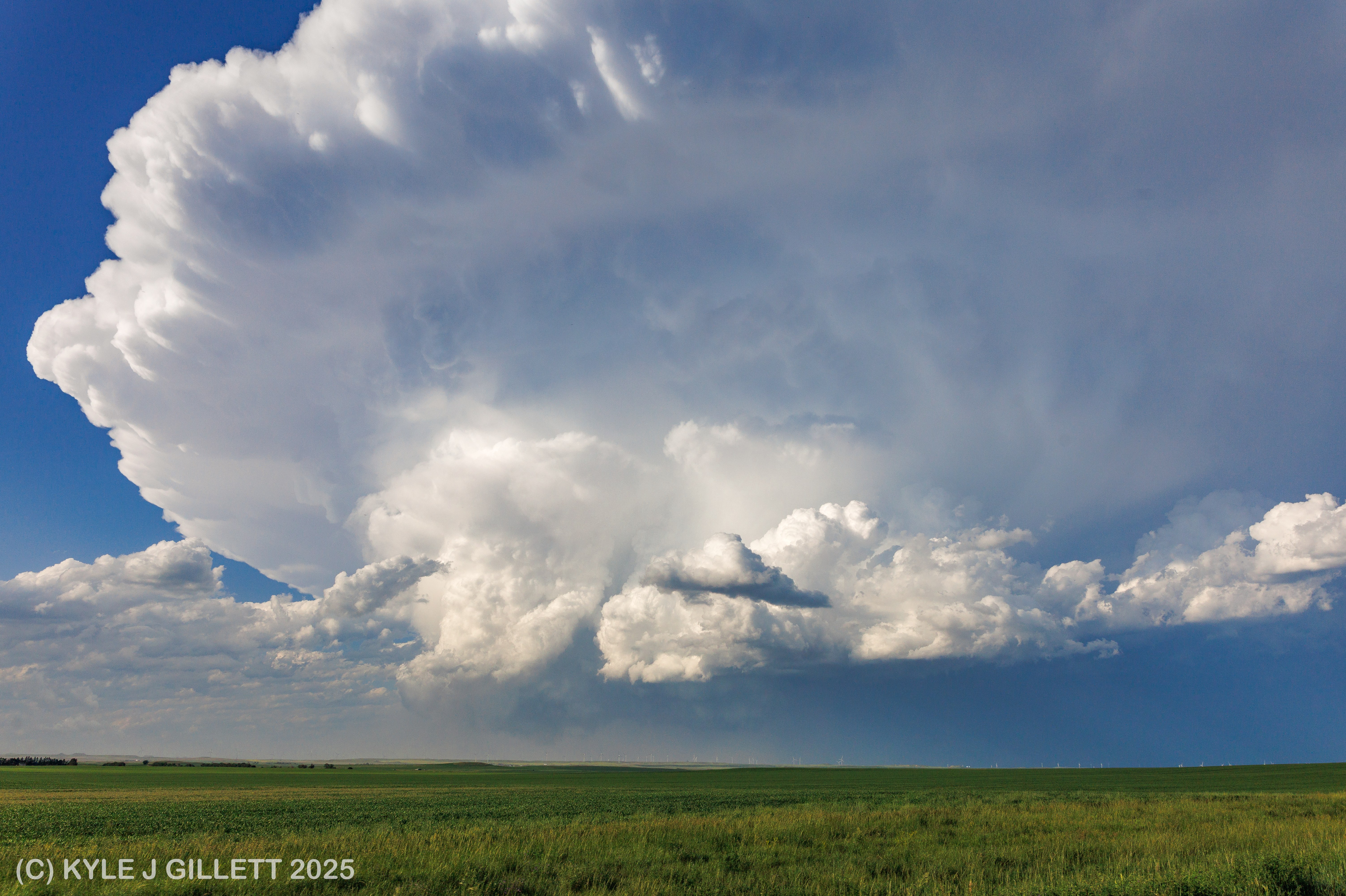 The supercell in the distance after producing the wedge tornado.